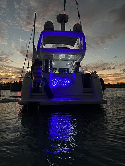 yacht docked at night tulum