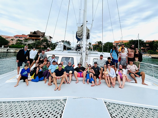 family on catamaran tulum