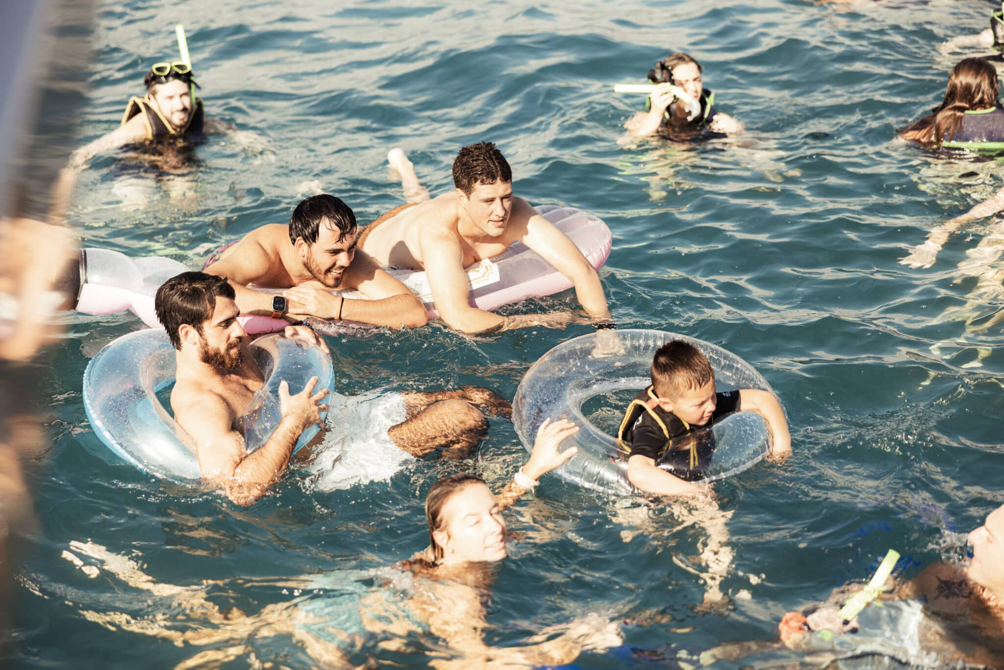 Friends swimming in the Caribbean sea Tulum Friends swimming in the Caribbean sea Tulum