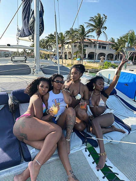 girls on catamaran